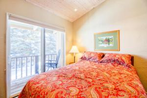 a bedroom with a bed and a large window at Val D Sol #23 in Sun Valley