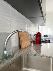 a kitchen counter top with a sink and a counter top at Apartamento Hifrensa in Hospitalet de l'Infant