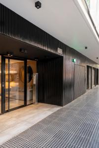 an empty lobby of a building with glass doors at Top Rentals Palermo Hollywood in Buenos Aires