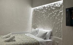 a bedroom with a bed with a painting on the wall at New Studio in Arachova in Arachova