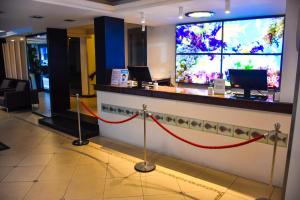 a bar with a red rope in a hotel lobby at Sandri City Hotel in Balneário Camboriú