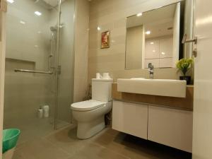 a bathroom with a toilet and a sink and a shower at The Perfect Retreat @One Bukit Ceylon (UNIT 25-2) in Kuala Lumpur