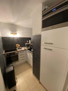 Kuchyňa alebo kuchynka v ubytovaní Appartement Cap d Agde Magnifique vue mer