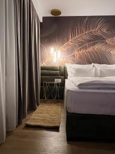 Un pat sau paturi într-o cameră la Boutique Villa Isabelle