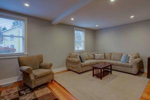 a living room with a couch and two chairs and a table at Calla Lily Farmhouse in Manheim