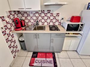 Kuchyňa alebo kuchynka v ubytovaní Superbe Type 2 - Cosy et Chaleureux