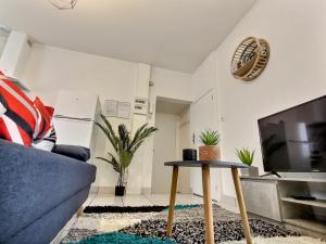 Televízia a/alebo spoločenská miestnosť v ubytovaní Superbe Type 2 - Cosy et Chaleureux