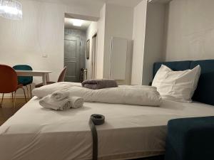 A bed or beds in a room at Ulivo Suites - apartments
