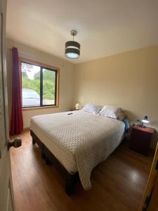 Ένα ή περισσότερα κρεβάτια σε δωμάτιο στο Cabañas Francisca