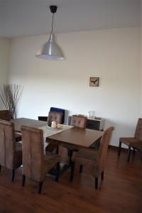 a dining room with a table and chairs at O Cantinho Alentejano in Cuba