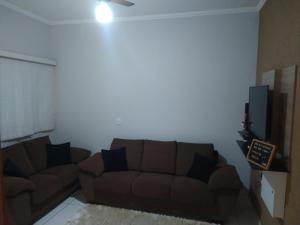 Uma área de estar em Casa De Temporada Seja Bem Vindos