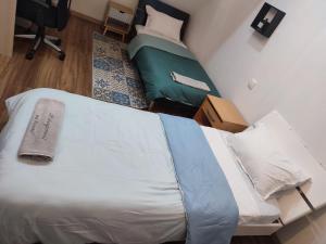 Posteľ alebo postele v izbe v ubytovaní HÉBERGEMENT au BERCAIL