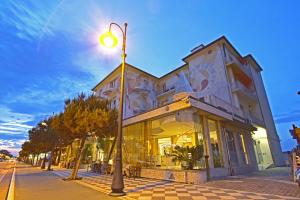 a street light in front of a building at Hotel Stella Maris in Cesenatico