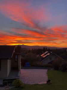 a sunset from the roof of a house at Chata V Lukách in Jablonec nad Nisou