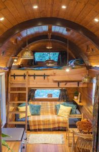 a room with bunk beds in a tree house at Get Away Hide Away in East Dereham