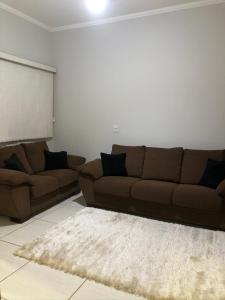 Uma área de estar em Casa De Temporada Seja Bem Vindos
