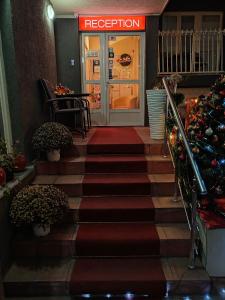 a staircase leading to a door to a restaurant at Bed and Breakfast Majesty in Niš