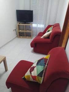 Telewizja i/lub zestaw kina domowego w obiekcie Vivienda en el casco histórico de Baiona