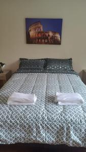 a bed with two white pillows on top of it at Casa Don Alonso Temuco in Temuco