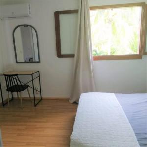 เตียงในห้องที่ Apt Almas, en résidence avec piscine