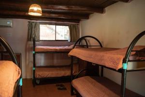 Voodi või voodid majutusasutuse Hostel La Botella de Leche - Tamarindo toas