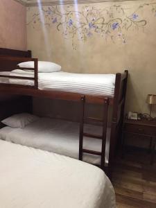 Postel nebo postele na pokoji v ubytování Hotel Ines Maria