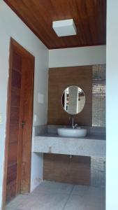 a bathroom with a sink and a mirror at Pousada e Hostel VILA MARINA in Salvador