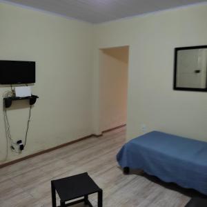 TV a/nebo společenská místnost v ubytování Pousada Casa Valério