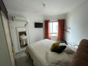 Ένα ή περισσότερα κρεβάτια σε δωμάτιο στο Itapema-Meia Praia- 3 quartos - Frente Mar! +57 φωτογραφίες