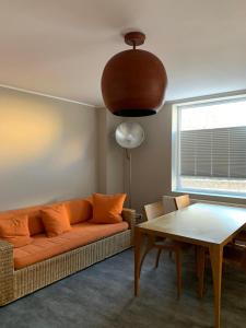 a living room with a couch and a table at ALB-APARTMENT-WESTERHEIM Kurort in Westerheim