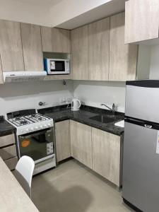 Una cocina o kitchenette en Departamento Pueyrredón