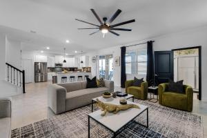 a living room with a couch and a table at Disney Dream Vacation Home by Disney in Kissimmee