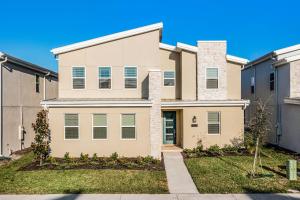 a large house with a driveway at Disney Dream Vacation Home by Disney in Kissimmee