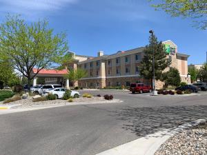 a parking lot with cars parked in front of a building at Holiday Inn Express Hotel Twin Falls, an IHG Hotel in Twin Falls