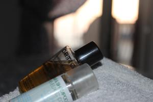 two bottles of lipstick sitting on top of a table at Casa Blu Cobalto in Maiori
