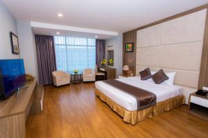 Postel nebo postele na pokoji v ubytování Muong Thanh Grand Hanoi Hotel