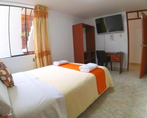 Postel nebo postele na pokoji v ubytování Sumaq Dreams Ayacucho