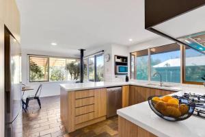 a kitchen with a bowl of fruit on a counter at Beachside Serenity - a quiet beachside hideaway in Mount Martha