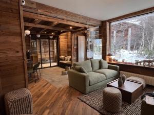a living room with a couch and a table at Everest Hotel in Val dʼIsère
