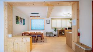 a kitchen and dining room with a table and chairs at Moon Drawing Goeun in Chuncheon