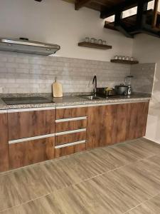 a kitchen with a sink and a counter top at Departamento en Esmeraldas in Esmeraldas