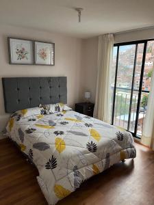 Krevet ili kreveti u jedinici u objektu Moderno y acogedor apartamento en el mágico Cusco