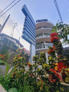 a building with flowers in front of it at Sky View Grand in Kandy