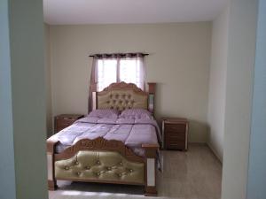 Postel nebo postele na pokoji v ubytování Cabrera Family Villa