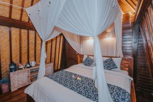 Postel nebo postele na pokoji v ubytování Dream Beach Huts