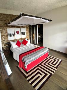 a bedroom with a large bed with a canopy at Romance in Ella in Ella