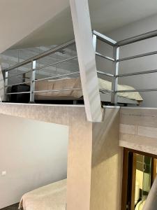 a room with two bunk beds and a staircase at Family room in Bakuriani in Bakuriani