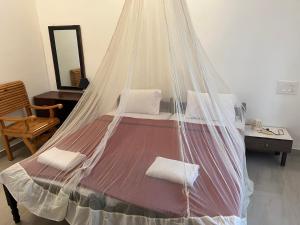 Krevet ili kreveti u jedinici u okviru objekta Kuppath Inn