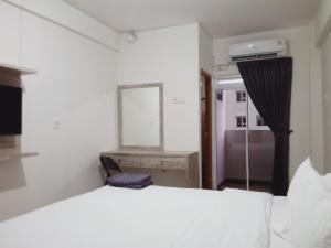 Postel nebo postele na pokoji v ubytování De Green Inn Serua
