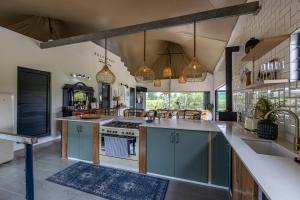 a kitchen with blue cabinets and a counter top at Belvidere Country Estate in Karkloof Nature Reserve